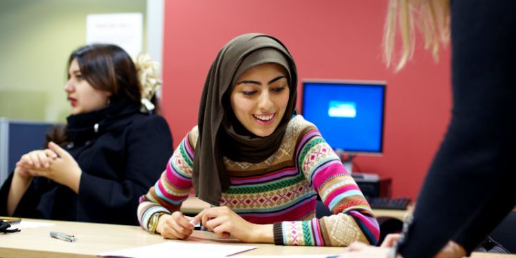 A college student talking to someone from The University of Leeds